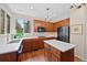 Bright kitchen features wood cabinets, white countertops, an island, and stainless-steel appliances at 7638 S Hudson Way, Centennial, CO 80122