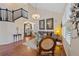 Living room with vaulted ceilings, hardwood floors, a staircase, and a sofa at 7638 S Hudson Way, Centennial, CO 80122