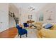 Open-concept living room with hardwood floors, vaulted ceiling, and staircase at 7638 S Hudson Way, Centennial, CO 80122