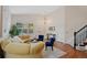 Inviting living room with hardwood floors, a bright window, and elegant decor at 7638 S Hudson Way, Centennial, CO 80122