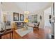 Living room with hardwood floors, vaulted ceilings, a large window, and a sofa at 7638 S Hudson Way, Centennial, CO 80122