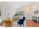 Bright living room featuring vaulted ceilings, hardwood floors, and elegant chandelier at 7638 S Hudson Way, Centennial, CO 80122