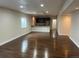 Spacious finished basement with hardwood floors, bar area, and ample space for entertaining at 22822 E Union Cir, Aurora, CO 80015