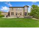 A beautiful landscaped backyard offers a private outdoor space with well-maintained lawn at 2647 Gray Wolf Loop, Broomfield, CO 80023