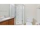 Bright bathroom featuring a glass-enclosed shower, vanity, and toilet, providing a clean and functional space at 2647 Gray Wolf Loop, Broomfield, CO 80023