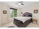 Comfortable bedroom with a large window offering natural light, carpet floors, and ample space to relax at 2647 Gray Wolf Loop, Broomfield, CO 80023