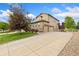 Beautiful two-story home with a large driveway and an attached two-car garage at 2647 Gray Wolf Loop, Broomfield, CO 80023