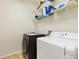 Functional laundry room with modern washer and dryer, providing convenience and efficiency for laundry tasks at 2647 Gray Wolf Loop, Broomfield, CO 80023