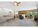 Open-concept living area showcasing seamless flow between living room, kitchen, and breakfast nook, promoting connectivity at 2647 Gray Wolf Loop, Broomfield, CO 80023