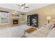 Bright living room with a cozy fireplace, mounted TV, and comfortable sofa, offering a relaxed and inviting space at 2647 Gray Wolf Loop, Broomfield, CO 80023