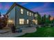 Charming home exterior with stone accents, well-manicured lawn, and lovely patio area at 2647 Gray Wolf Loop, Broomfield, CO 80023