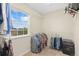 Organized walk-in closet with hanging clothes and storage shelves by a window at 2647 Gray Wolf Loop, Broomfield, CO 80023