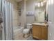 Well-lit bathroom featuring a shower, vanity, and tile flooring at 11277 Osage Cir # E, Westminster, CO 80234