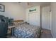 Bedroom with desk, neutral carpet, and double-door closet at 11277 Osage Cir # E, Westminster, CO 80234