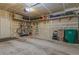 Spacious garage with storage shelves, hooks, door to outside, and room for storage at 11277 Osage Cir # E, Westminster, CO 80234