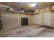 Two-car garage features a concrete floor, shelving, and a utility door at 11277 Osage Cir # E, Westminster, CO 80234