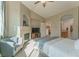 Comfortable main bedroom with a fireplace and an open ensuite bathroom at 11277 Osage Cir # E, Westminster, CO 80234