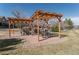 Common area with pergola covered picnic tables at 11277 Osage Cir # E, Westminster, CO 80234