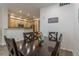 Open-concept dining area with access to a modern kitchen, perfect for Gathering meals and gatherings at 11277 Osage Cir # E, Westminster, CO 80234