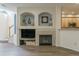Spacious living room with fireplace, custom built-ins, and open layout for entertaining and relaxation at 11277 Osage Cir # E, Westminster, CO 80234