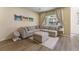 Cozy living room features plush sectional sofa, contemporary decor, and large windows for natural light at 11277 Osage Cir # E, Westminster, CO 80234