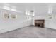 Finished basement features a charming brick fireplace and multiple windows, offering cozy comfort at 6285 W 35Th Ave, Wheat Ridge, CO 80033