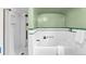 Classic bathroom featuring a shower, tub with tile surround, and vintage fixtures at 6285 W 35Th Ave, Wheat Ridge, CO 80033