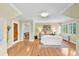 Cozy bedroom with natural light, hardwood floors, and a staircase view at 6285 W 35Th Ave, Wheat Ridge, CO 80033
