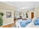 Bright bedroom with hardwood floors, seating area, and plants at 6285 W 35Th Ave, Wheat Ridge, CO 80033