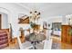 Dining room featuring a round table and chairs, chandelier, and hardwood floors at 6285 W 35Th Ave, Wheat Ridge, CO 80033