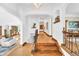Elegant entryway with wood floors, staircase, and arched doorways leading to other rooms at 6285 W 35Th Ave, Wheat Ridge, CO 80033