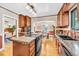 Spacious kitchen with wood cabinets, granite countertops, and stainless steel appliances at 6285 W 35Th Ave, Wheat Ridge, CO 80033