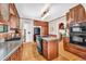 Traditional kitchen with wood cabinets, granite countertops, and stainless steel appliances at 6285 W 35Th Ave, Wheat Ridge, CO 80033