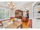 Open kitchen and dining area featuring hardwood floors, a chandelier, and eat-in kitchen dining at 6285 W 35Th Ave, Wheat Ridge, CO 80033