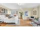 Bright bedroom with hardwood floors, large window, and sitting area at 6285 W 35Th Ave, Wheat Ridge, CO 80033