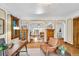 Stylish home office with hardwood floors, cozy seating, and open archways to living areas at 6285 W 35Th Ave, Wheat Ridge, CO 80033