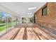 Bright sunroom featuring tile flooring, skylights, and large windows overlooking the backyard at 6285 W 35Th Ave, Wheat Ridge, CO 80033