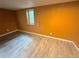 Cozy bedroom featuring a neutral color scheme, light wood floors, and a window for natural light at 9852 W 76Th Ave, Arvada, CO 80005