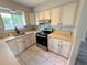 Well-lit kitchen with stainless steel appliances and ample counter space at 9852 W 76Th Ave, Arvada, CO 80005