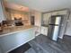 Modern kitchen with stone counter tops and stainless steel refrigerator at 9852 W 76Th Ave, Arvada, CO 80005