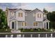 Beautiful two-story townhome showcasing a well-manicured lawn and inviting entrance at 14131 Deertrack Ln, Parker, CO 80134