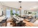 Open concept dining area with wooden table and hardwood floors at 4444 Irving St, Denver, CO 80211