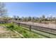 Backyard view with green grass and a wooden fence at 5335 S Lisbon Way, Centennial, CO 80015
