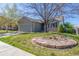 Landscaped front yard features lush green grass and decorative rocks, adding a touch of nature to the home's exterior at 5335 S Lisbon Way, Centennial, CO 80015