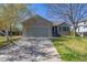 Charming home features a well-manicured lawn and a two-car garage, providing convenience and curb appeal at 5335 S Lisbon Way, Centennial, CO 80015