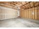 Spacious garage with concrete floors and plenty of storage space, ready for your vehicles and projects at 5335 S Lisbon Way, Centennial, CO 80015