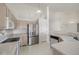 Kitchen with stainless steel refrigerator and dishwasher at 5335 S Lisbon Way, Centennial, CO 80015