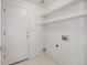 Practical laundry room with shelving and utility hookups at 5335 S Lisbon Way, Centennial, CO 80015