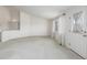 Bright and spacious living room with large windows, providing plenty of natural light and a welcoming atmosphere at 5335 S Lisbon Way, Centennial, CO 80015