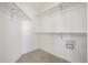 Functional walk-in closet with shelving and carpeted floor at 5335 S Lisbon Way, Centennial, CO 80015